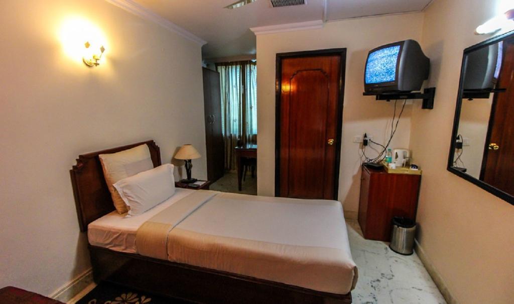 Hotel Pigeon International Bangalore Esterno foto