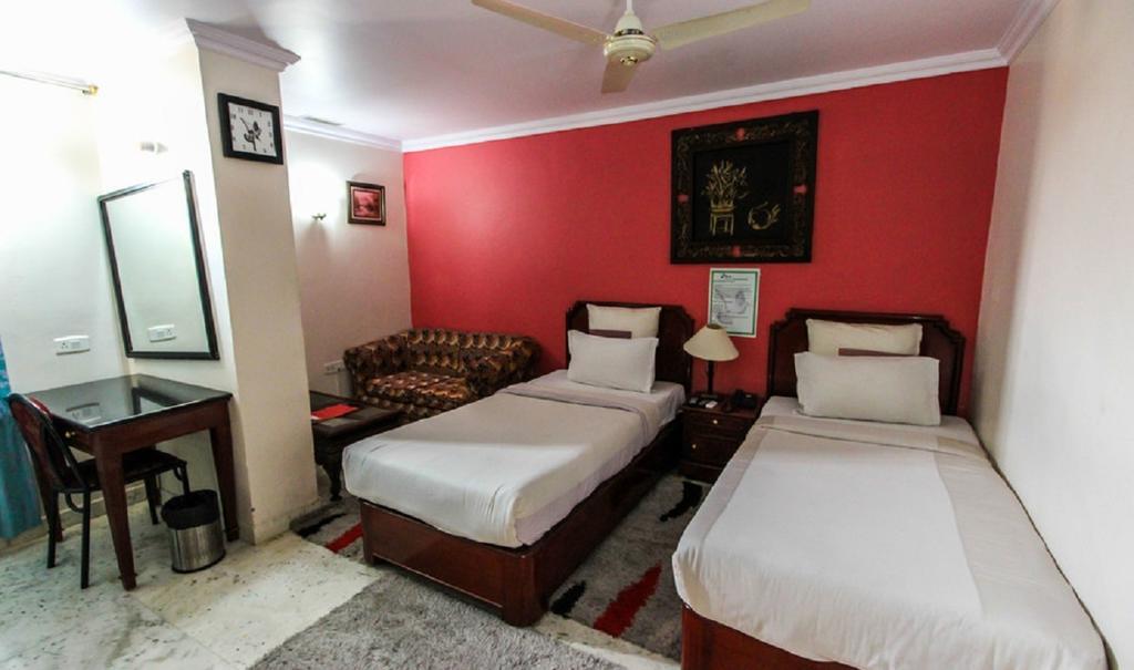 Hotel Pigeon International Bangalore Camera foto